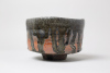 green, red, black 2026, 8 x 11,5 cm, wood kiln fired/ Holzbrand ~ 1350°C/ 68h, wild clay slip/ Shino/ Slipglasur aus wildem Ton Was man hier so wunderschön nach unten läuft ist eine ganz besondere Erde, die wir aus unserer Griechenlandreise mitgebracht haben. Die Schale ähnelt fast dem Fundort./ What is running down so beautifully here is a very special soil that we brought back from our trip to Greece. The bowl almost resembles the find spot.&nbsp;280 Euro&nbsp;Inquire