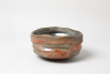 Marsgold 2026, 6 x12cm, wood kiln fired/ Holzbrand ~ 1350°C/ 68h, wild clay slip/ Shino/ Slipglasur aus wildem Ton Diese wunderbare flache Schale besticht mit ihrer Haptik und ihren warmen Rot-Orange-Tönen. Außen schon angedeutet, eröffnet sich im Inneren der Schale je nach Lichteinfall ein in Goldbronze schimmernder Kosmos. Es lebe der gefundene wilde Ton, der hier seinen Zauber im Feuer vollbracht hat./ This wonderful shallow bowl captivates with its tactile surface and its warm shades of red and orange. Hinted at on the exterior, a cosmos of shimmering gold-bronze tones reveals itself within, changing with the light. Long live wild-found clay, whose magic has been brought to life here through the fire.220 Euro&nbsp;&nbsp;Inquire&nbsp;